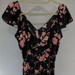 Black floral romper with ruffle edge
